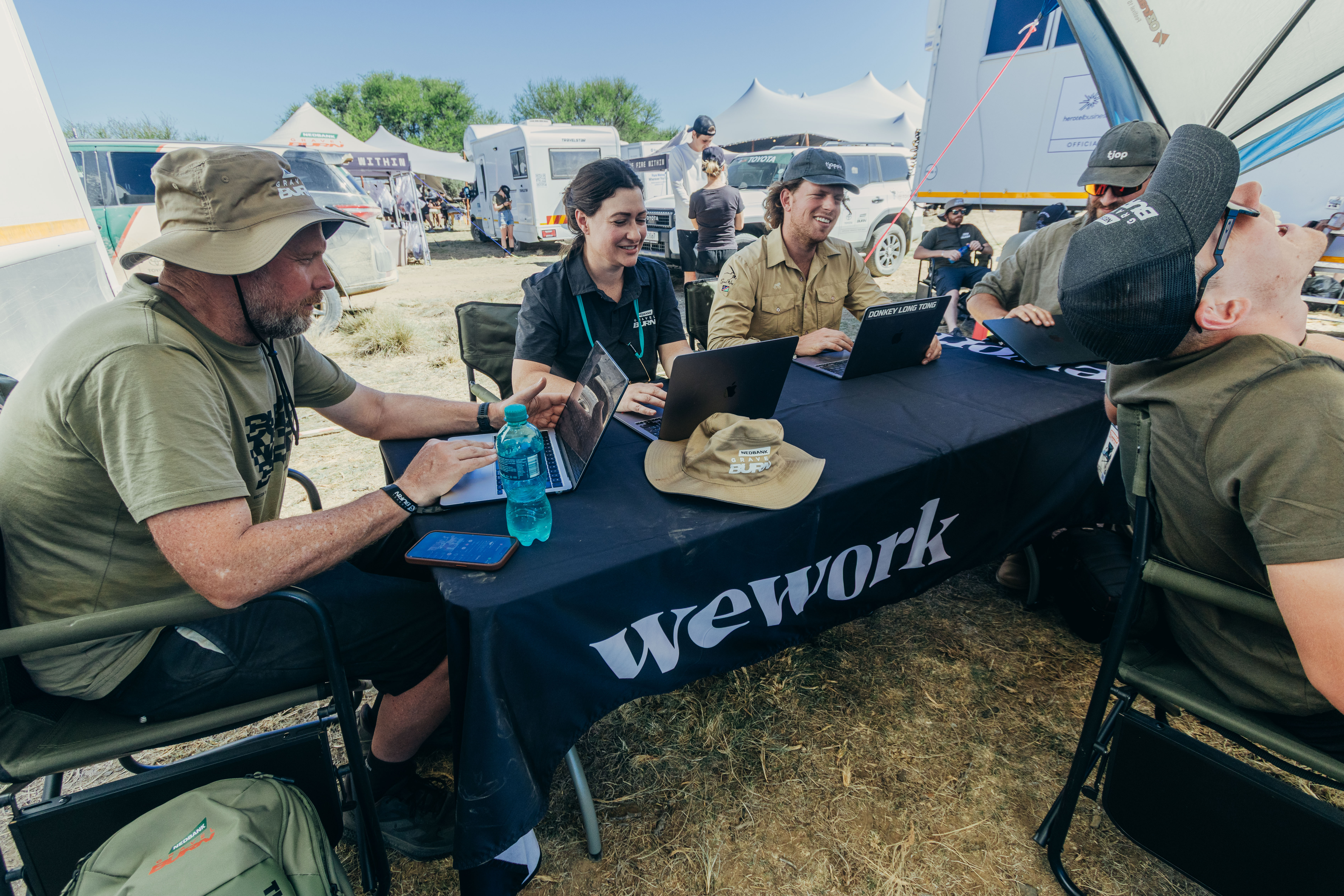 Gravel Burn event staff working on laptops at a camp. Supplied file photograph.