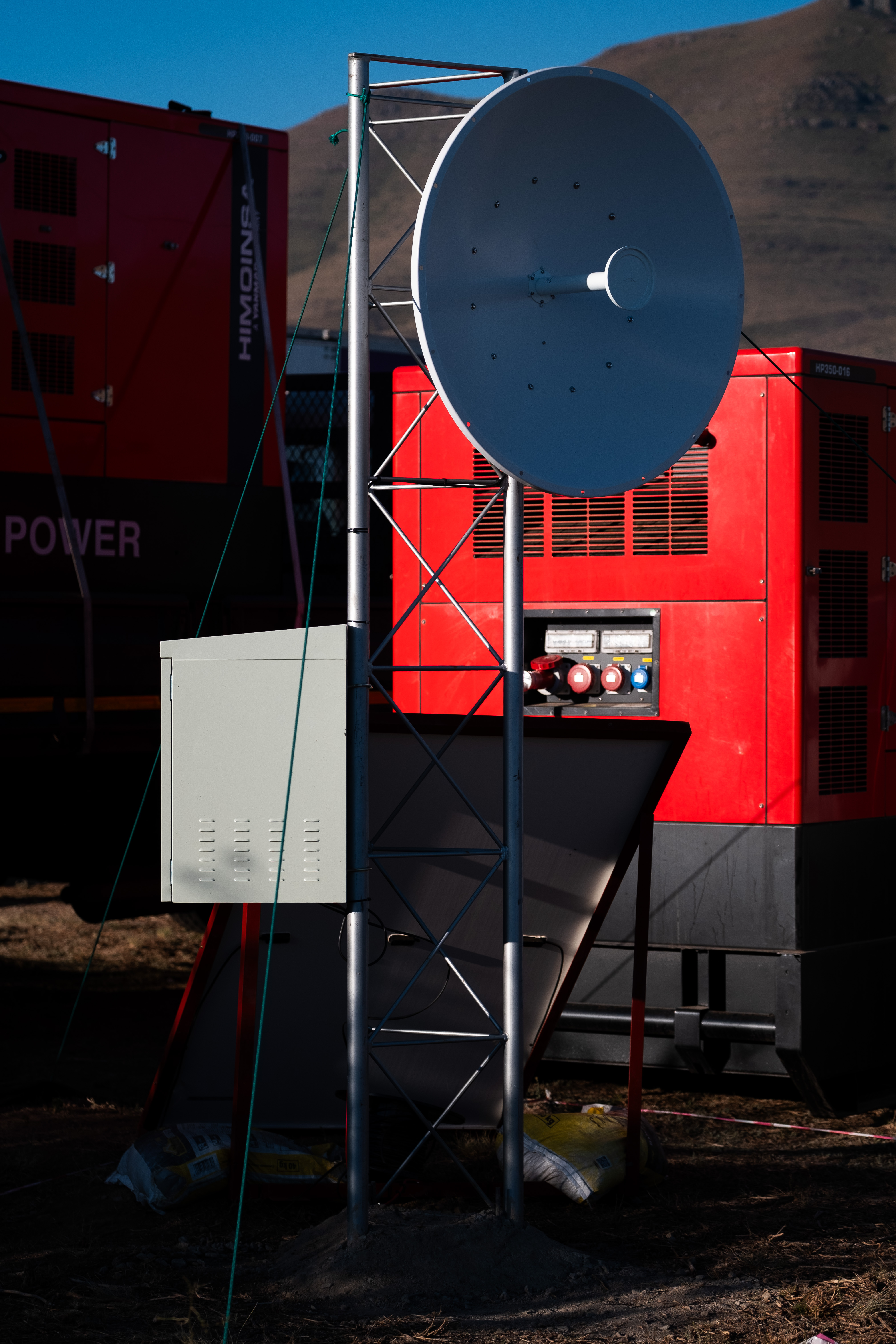 Communications equipment and generators at a Gravel Burn camp.